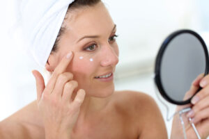 Woman applying her medical grade skincare for deeper absorption